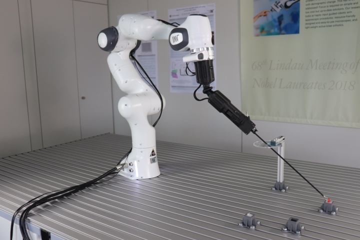 Articulated robotic arm with surgical instrument 